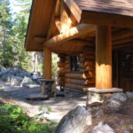 cedar log and stone entryway