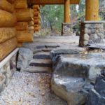 Log home stone landscaping