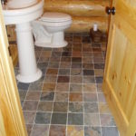 Slate floor, pine door cedar log walls