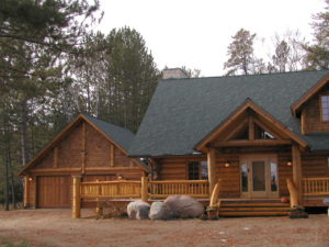 Cedar log home, entry and garage